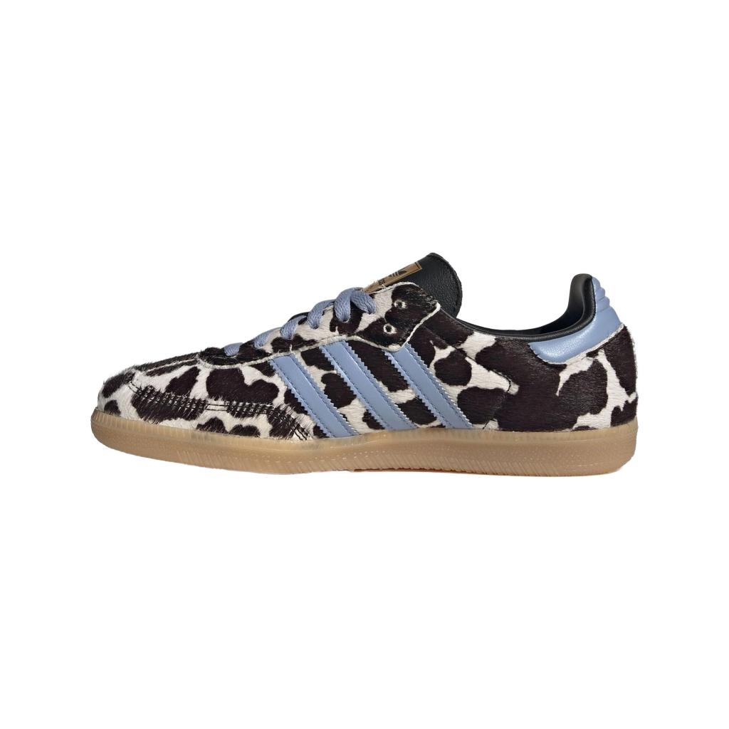 Cow-print low-top sneakers with light blue stripes, lace-up, gum sole