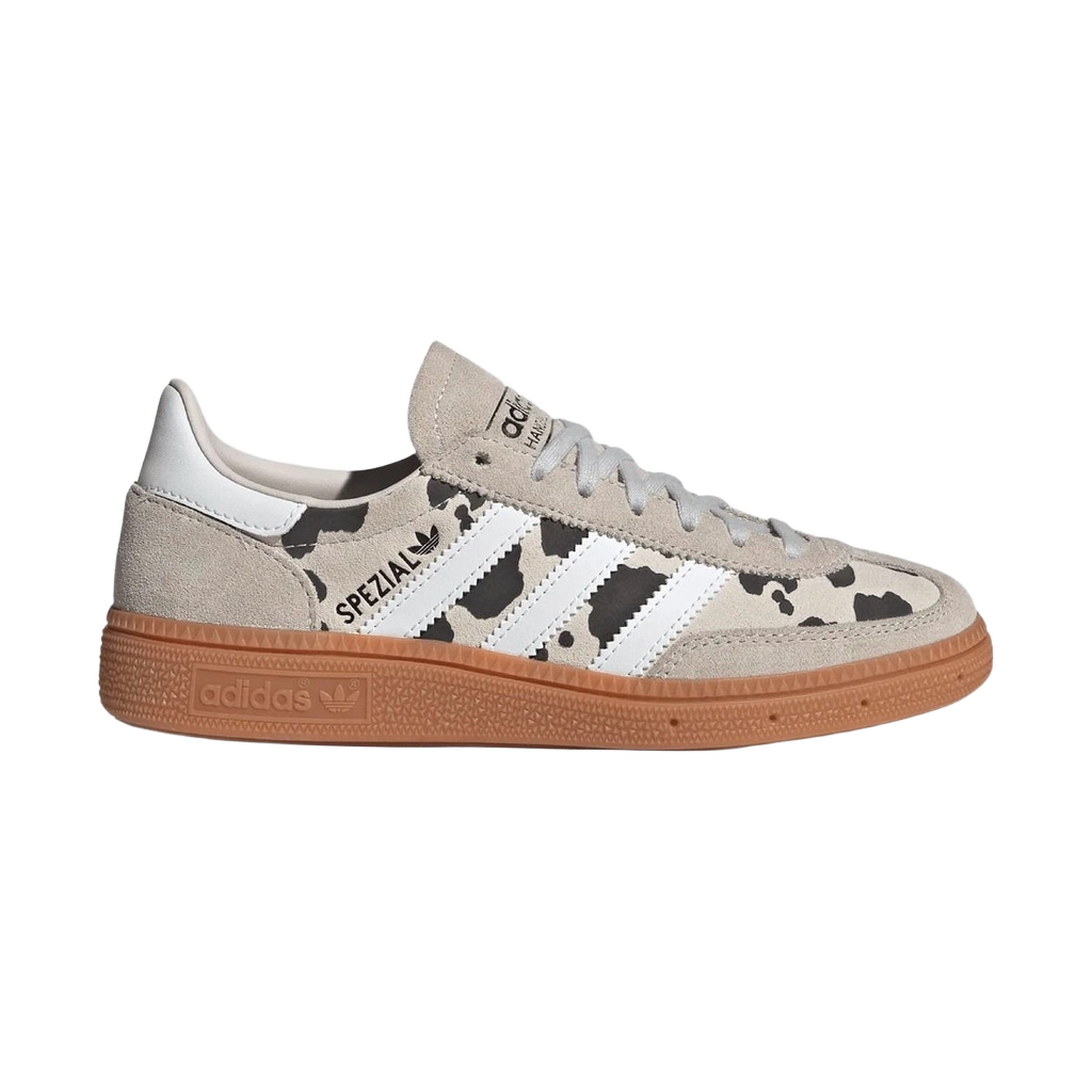 Kids' Adidas Handball Spezial sneakers, three-quarter view; grey suede, white stripes, gum sole.