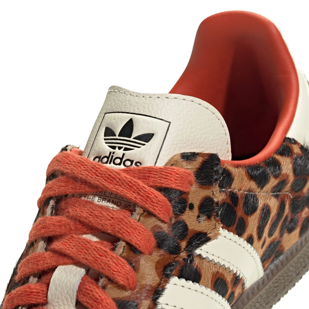Close-up of Adidas Samba OG leopard-print upper with red laces and trefoil heel patch