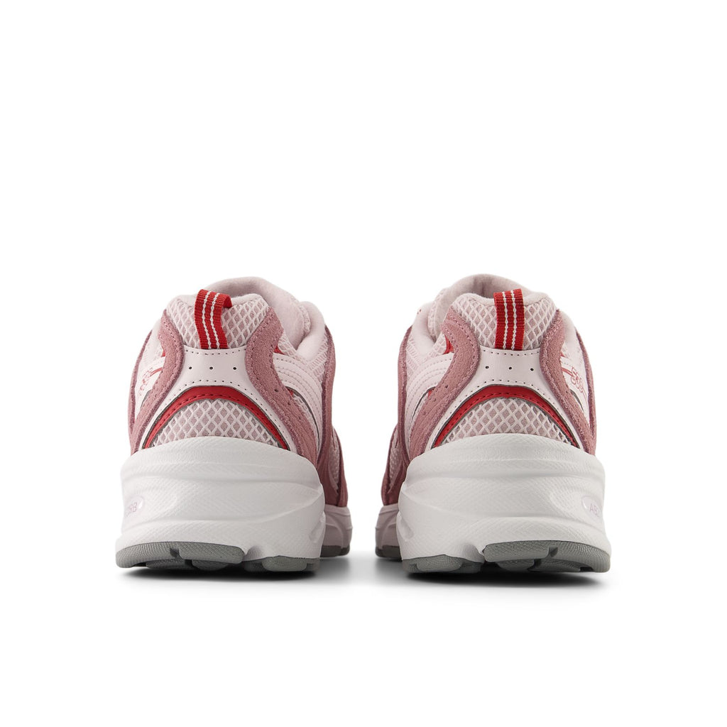 New Balance unisex 530 running shoes, heel view in rosewood and pink with white sole