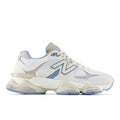 Colorblocked lace-up sneakers with blue panels, beige overlays, and chunky sole