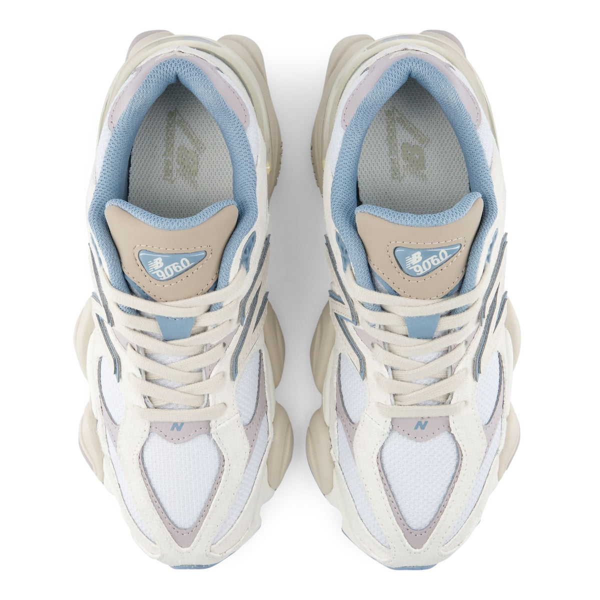 Pair of lace-up sneakers showing blue insoles and New Balance tongue branding