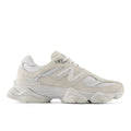 Beige and white low-top sneakers with wavy sole and lace-up closure