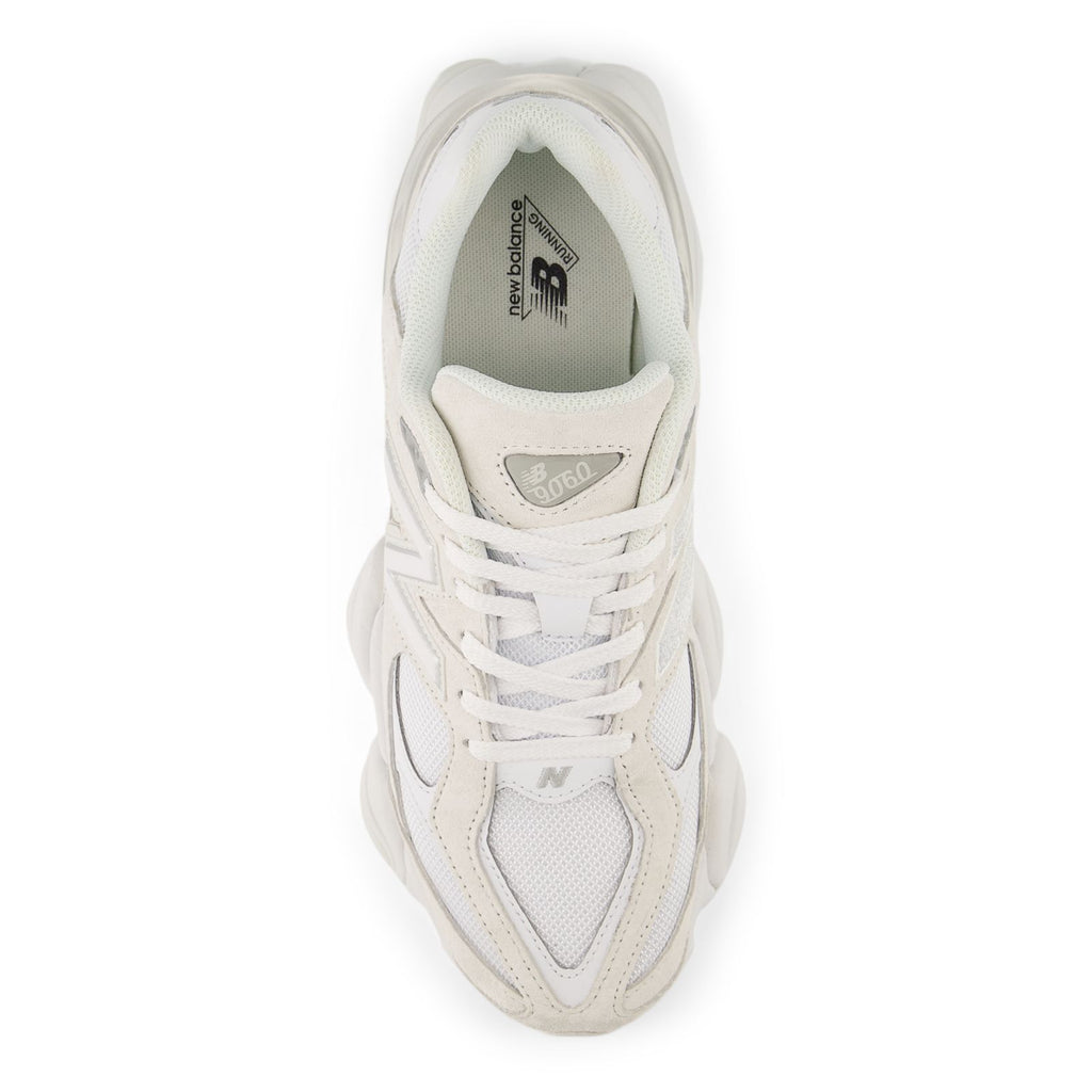 Beige and white sneaker interior with tongue label and lace-up opening