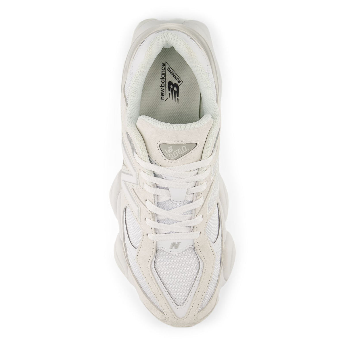 Beige and white sneaker interior with tongue label and lace-up opening
