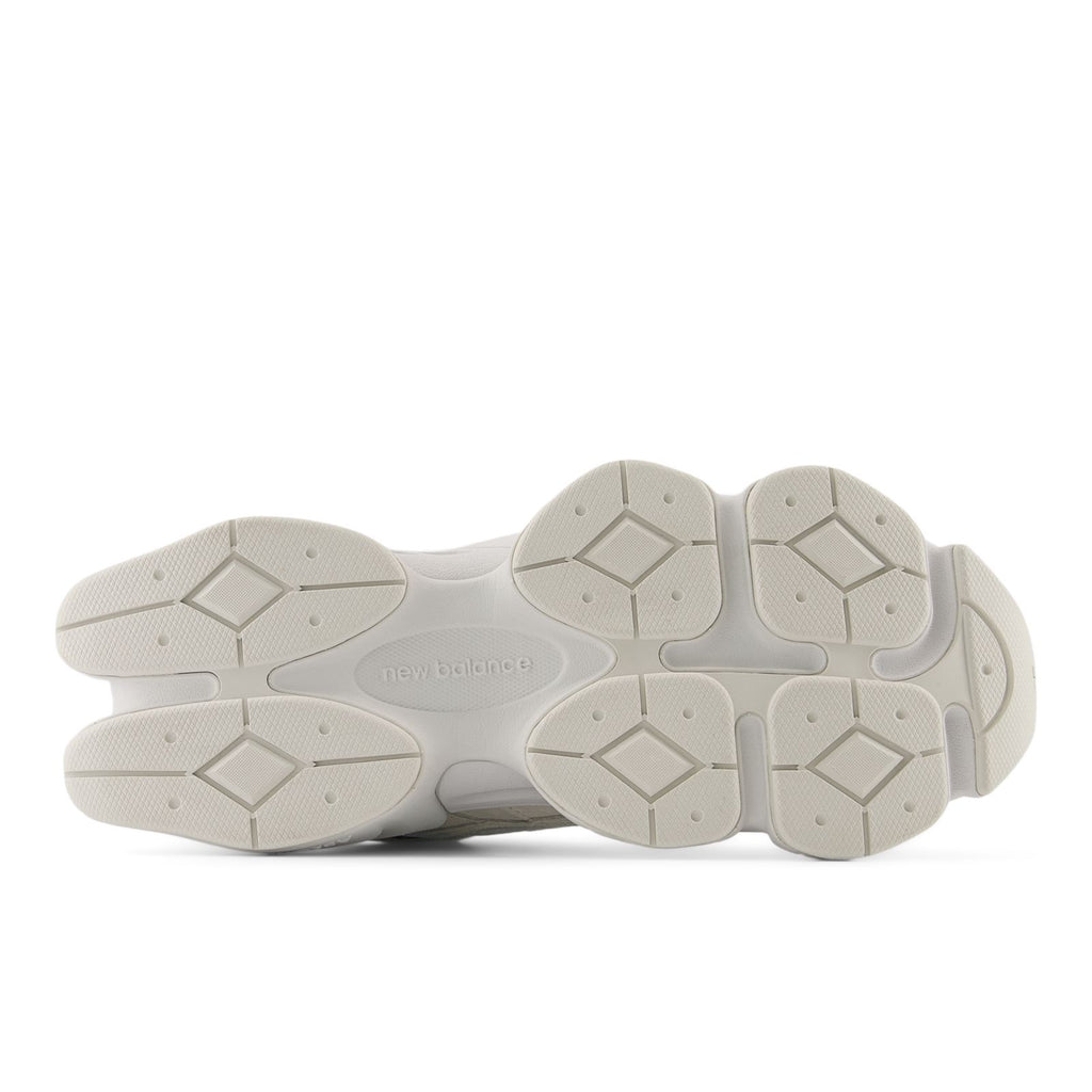 Light beige outsole view of lace-up sneakers with hexagon traction pattern