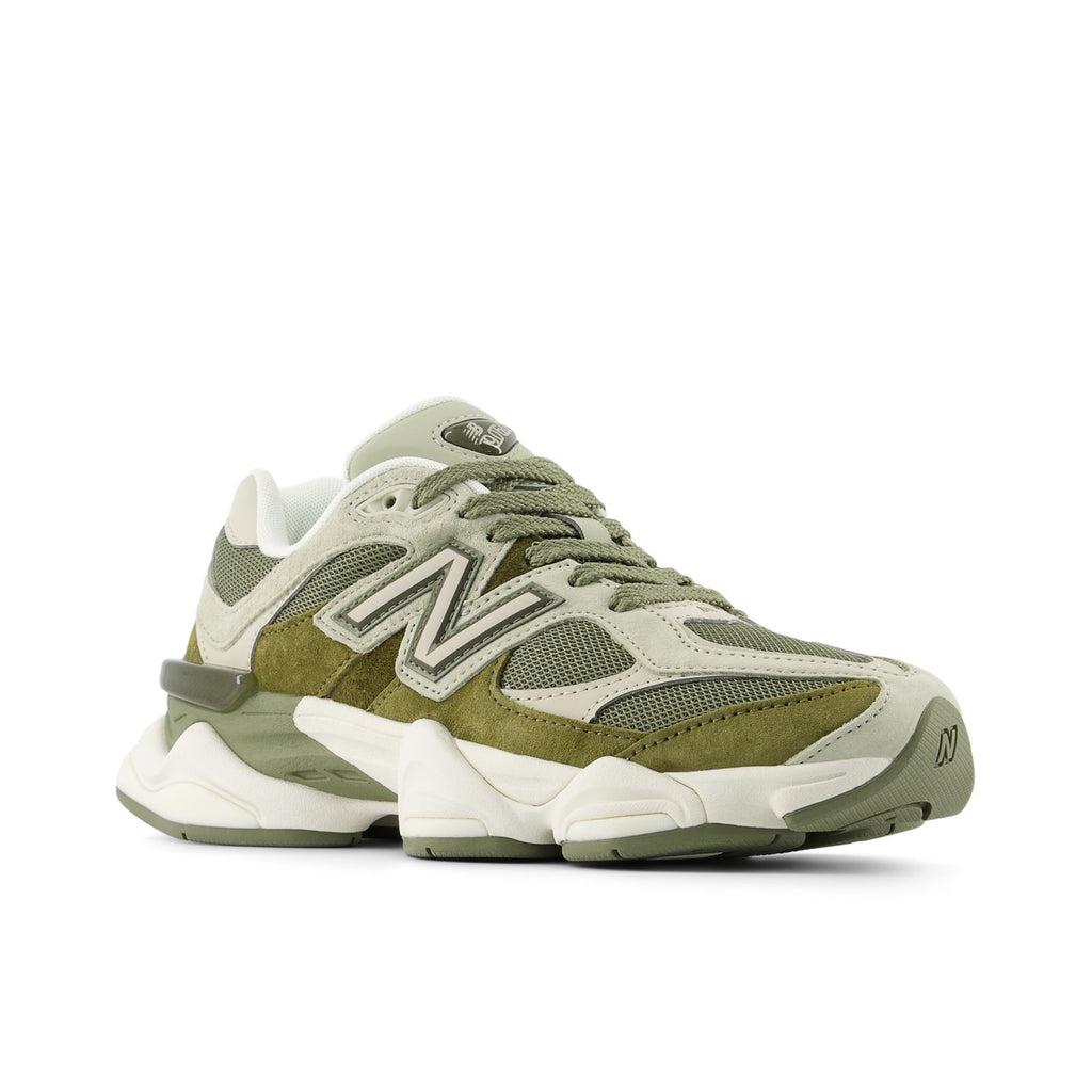 New Balance sneakers, angled side view, olive overlays with white mesh and textured details