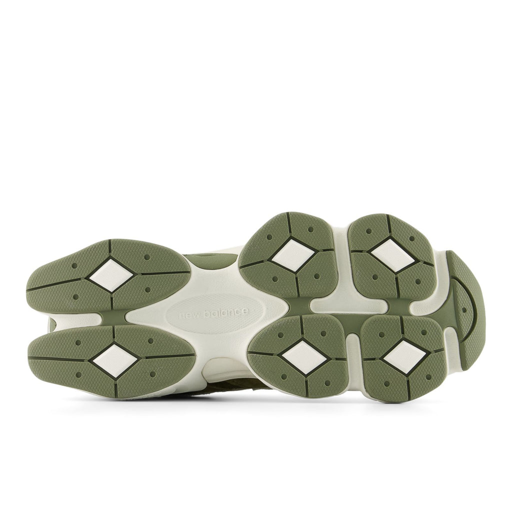 New Balance sneakers, underside view, olive rubber traction outsole and heel pods