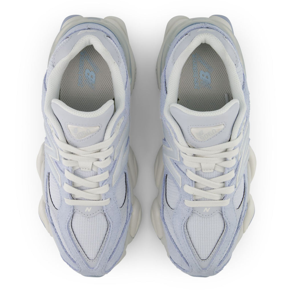 Pair of light indigo lace-up sneakers showing inner lining and cushioned padded collars