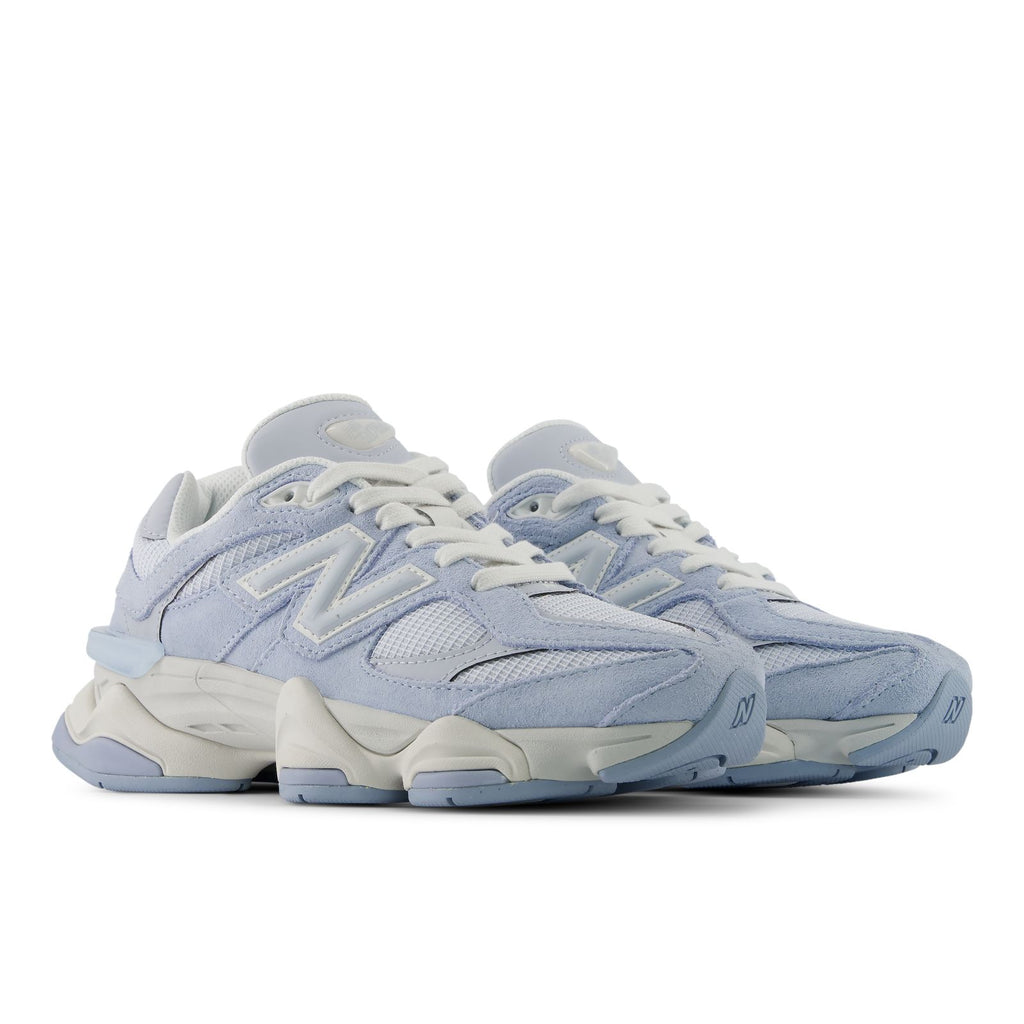 Light indigo lace-up sneakers with off-white midsoles and textured side panel detailing