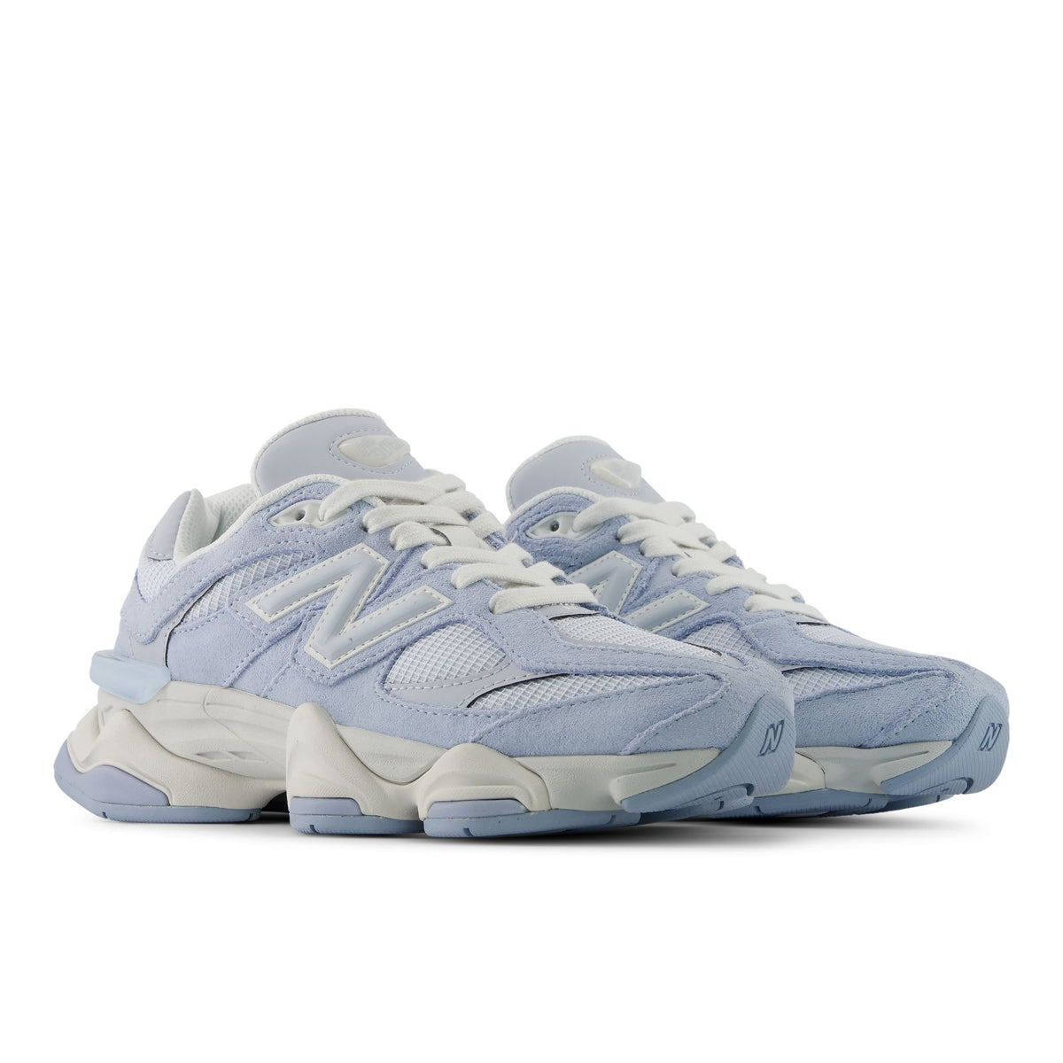 Light indigo lace-up sneakers with off-white midsoles and textured side panel detailing