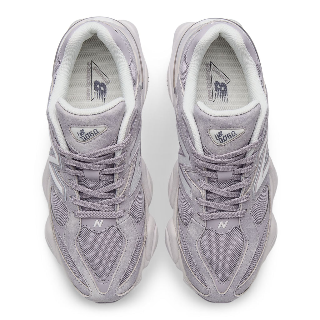 New Balance 9060 sneakers, close-up of laces and inner tongue logo