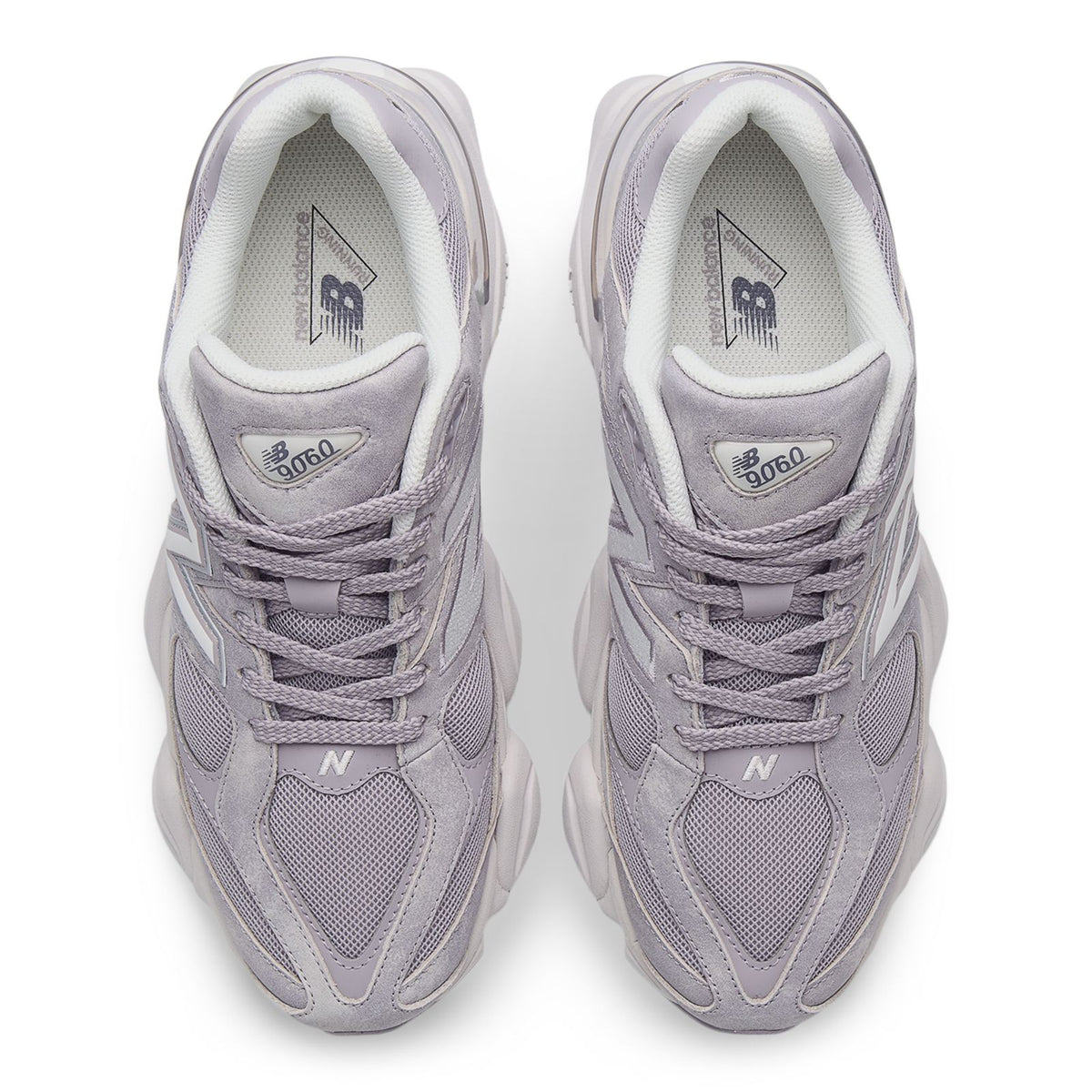 New Balance 9060 sneakers, close-up of laces and inner tongue logo