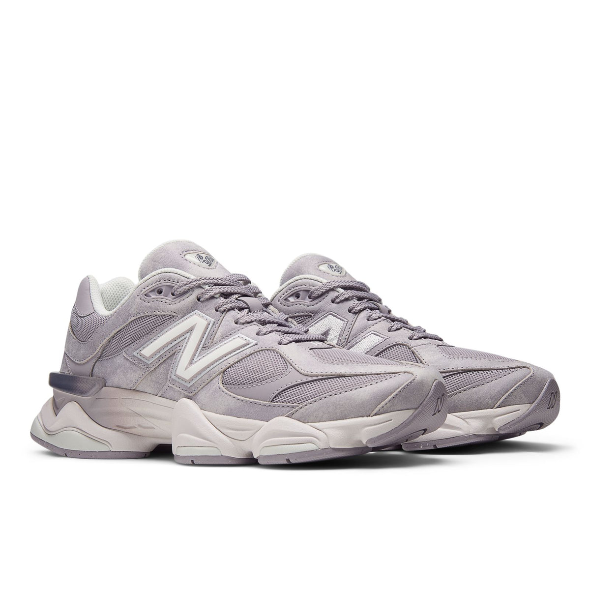 New Balance 9060 sneakers, side view with chunky sole and lace-up closure