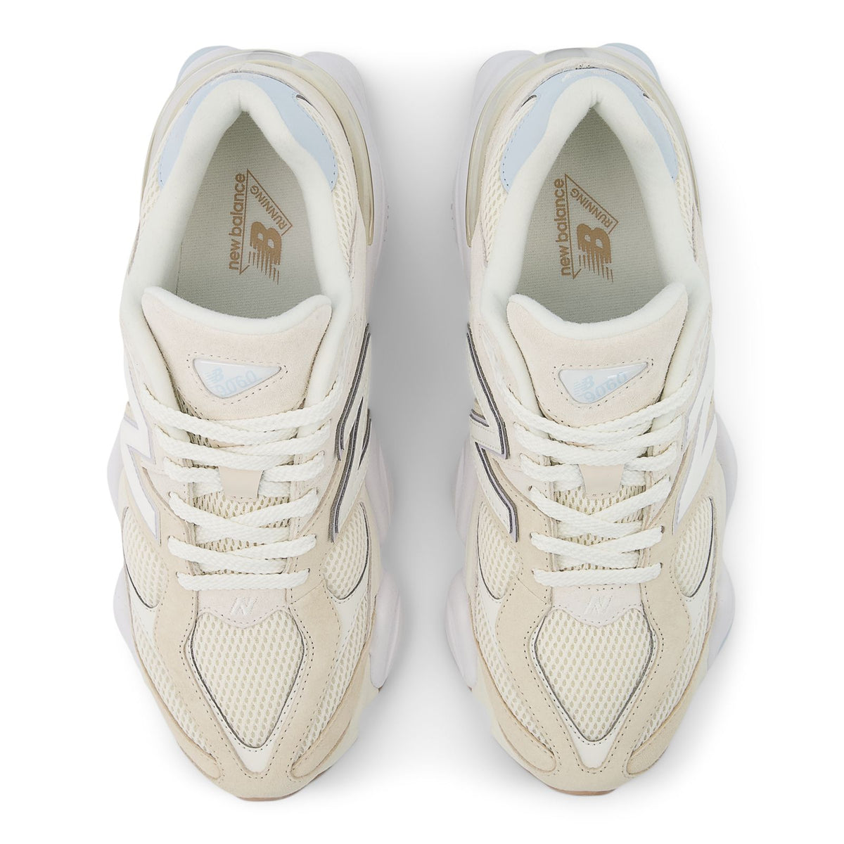New Balance 9060 shoes top view in bisque with white laces and blue logo accents