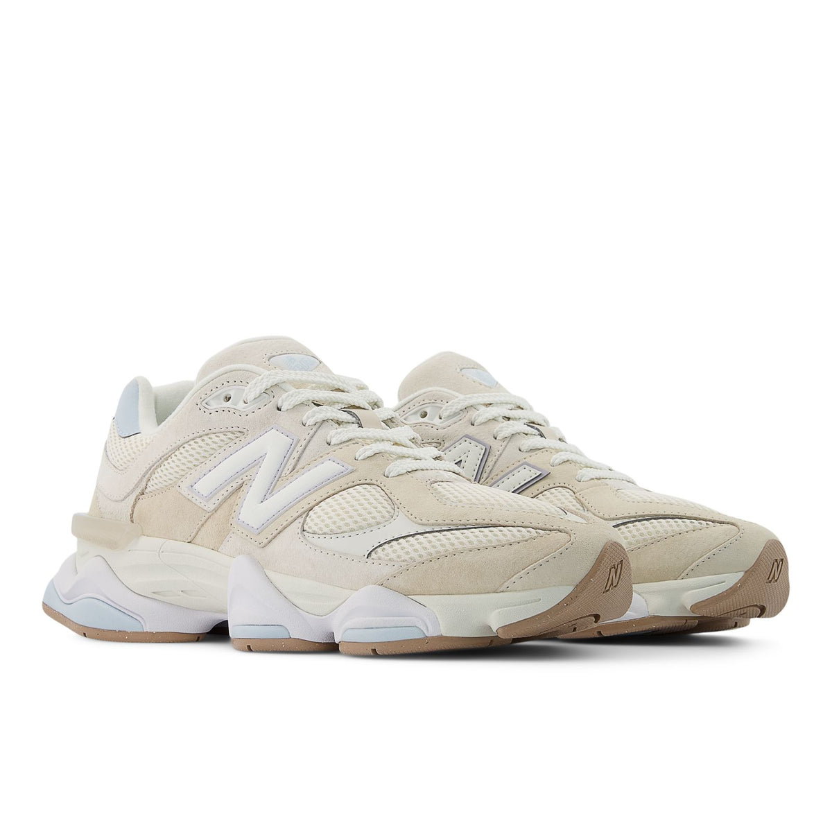 New Balance 9060 sneakers in bisque, lace-up with light blue overlays and sculpted sole
