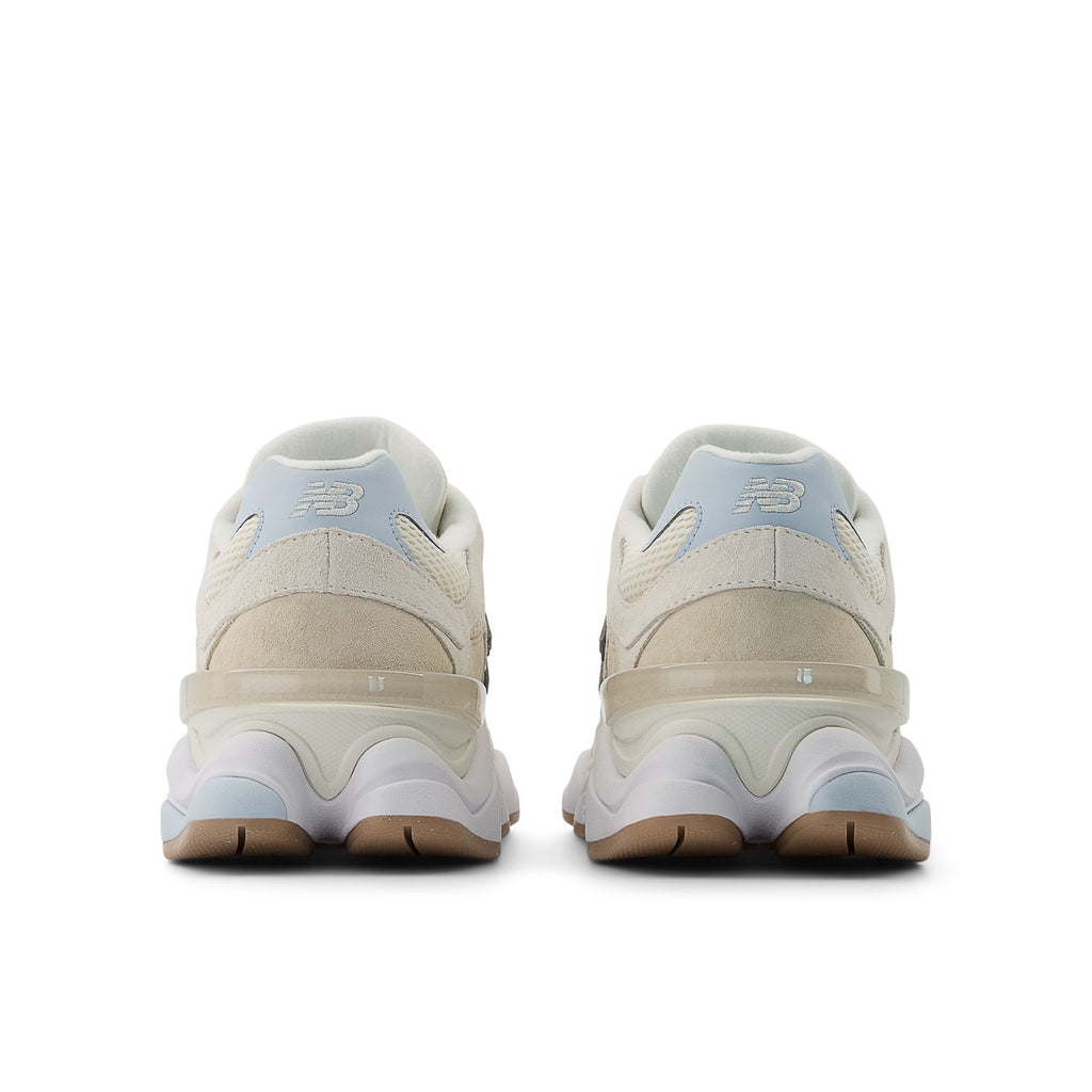 New Balance 9060 shoes, back view in bisque with blue heel accents and cushioned sole