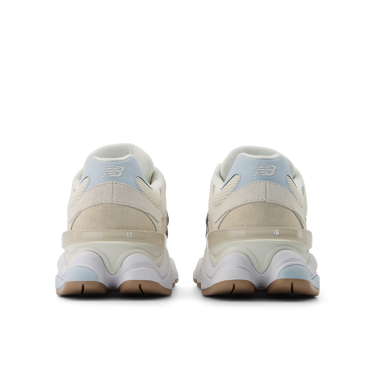 New Balance 9060 shoes, back view in bisque with blue heel accents and cushioned sole