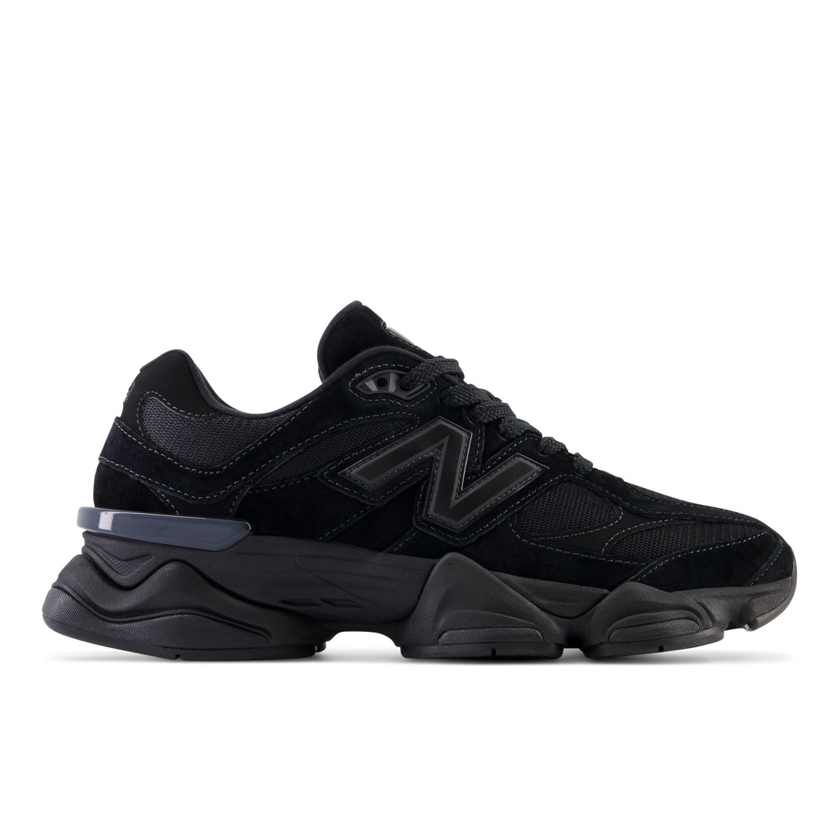 New Balance 9060 running shoes in dark black with blue accent, chunky sole