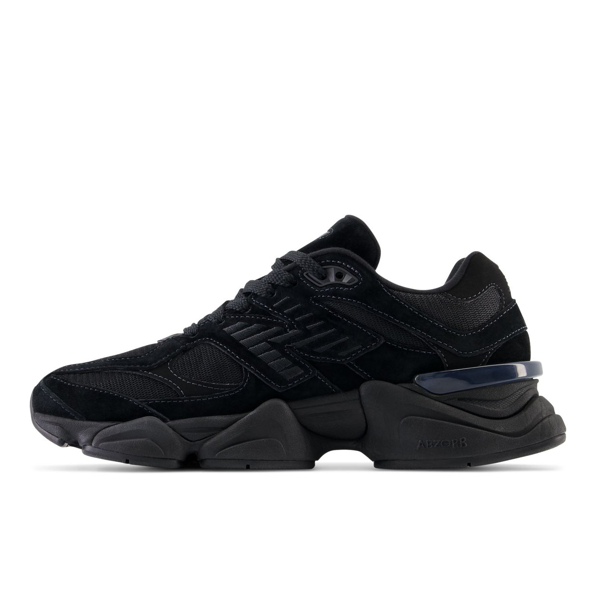 New Balance 9060 running shoes, dark black panels with blue trim and laces