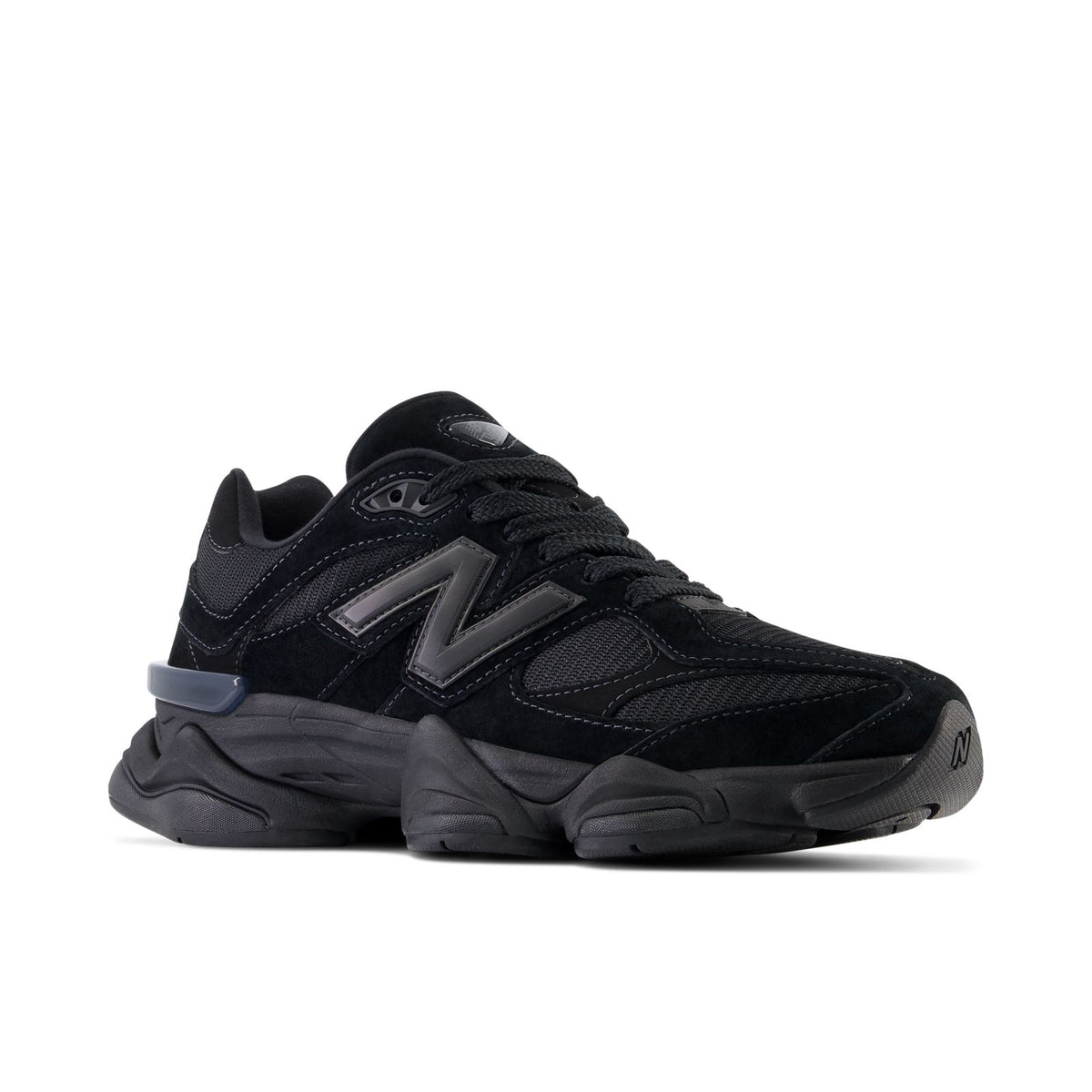 New Balance 9060 running shoes, dark black upper with blue heel accent