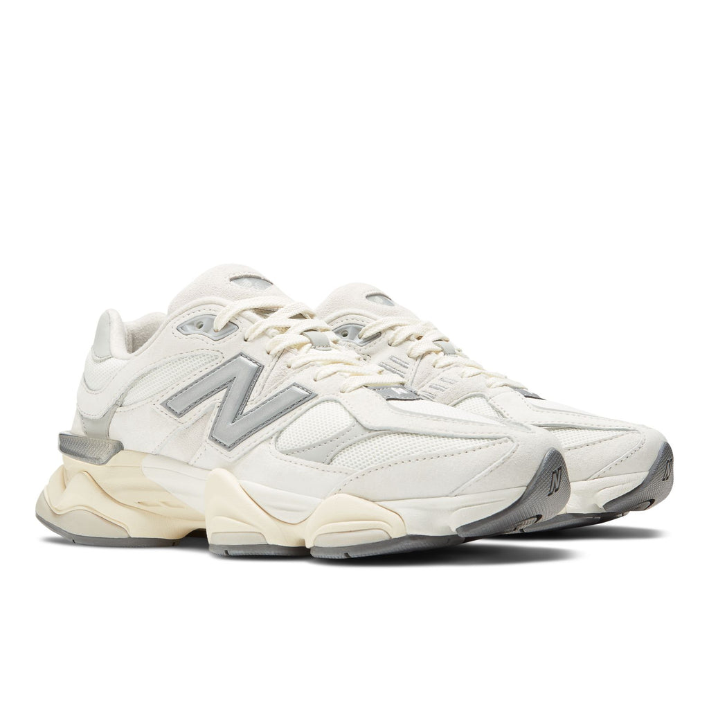 New Balance 9060 unisex sneakers, side view with sea-salt panels and metallic logo