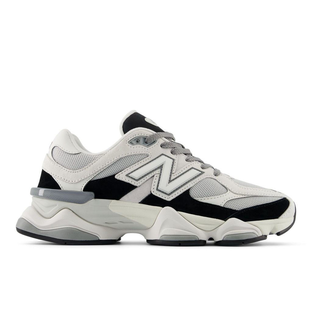 Unisex running shoes in white/black with gray laces and chunky cushioned sole