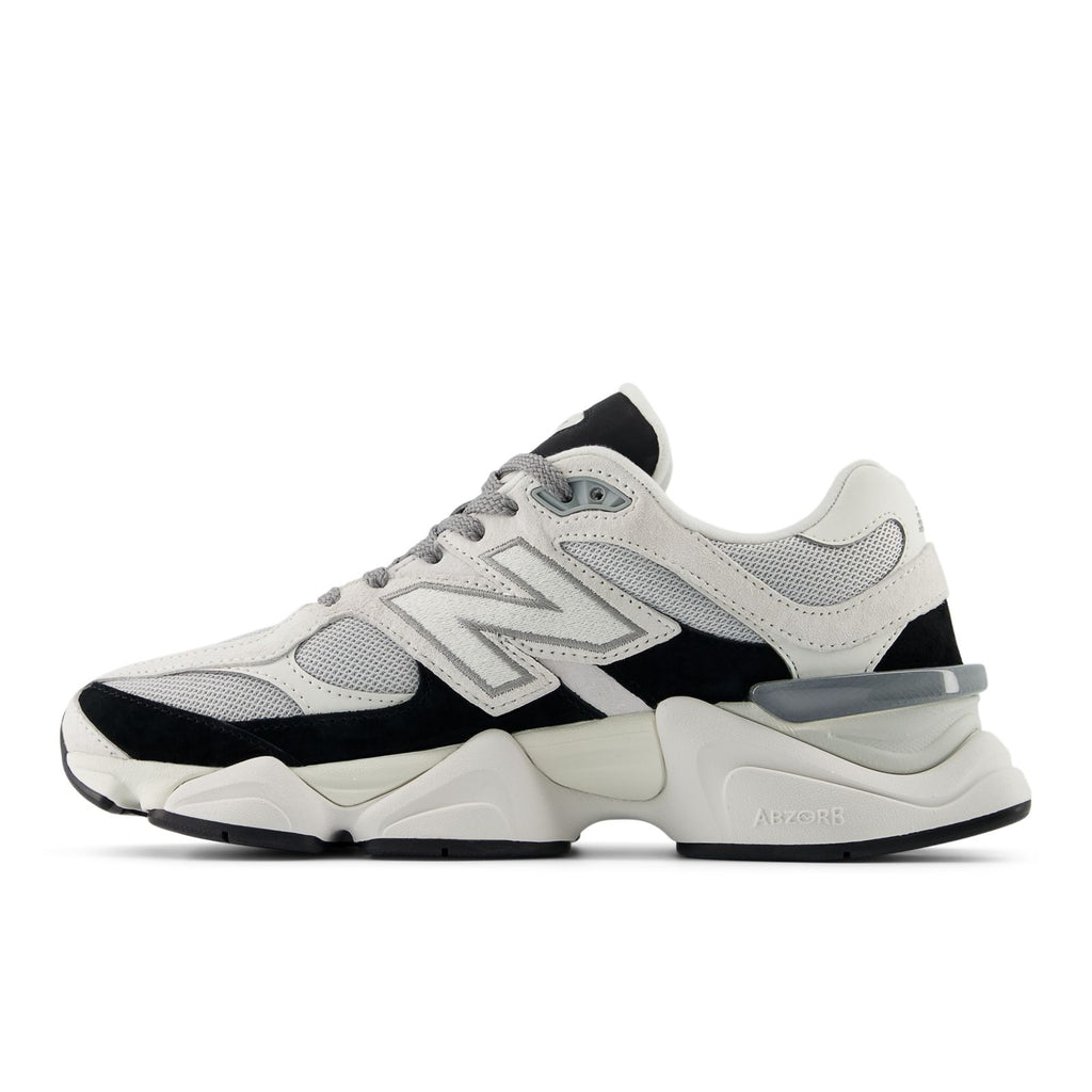 Unisex running shoes with white upper, black side panels, and light gray sole