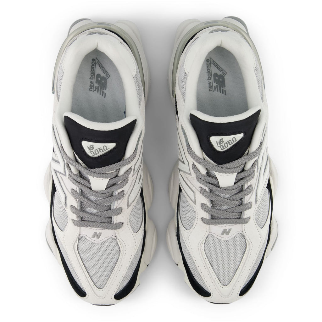 Pair of unisex running shoes, white mesh with gray laces and black heel details