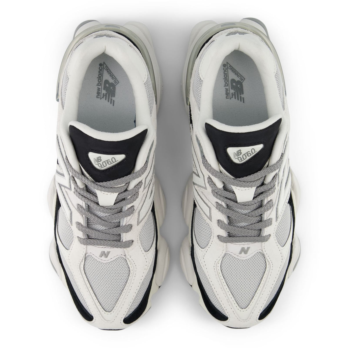 Pair of unisex running shoes, white mesh with gray laces and black heel details