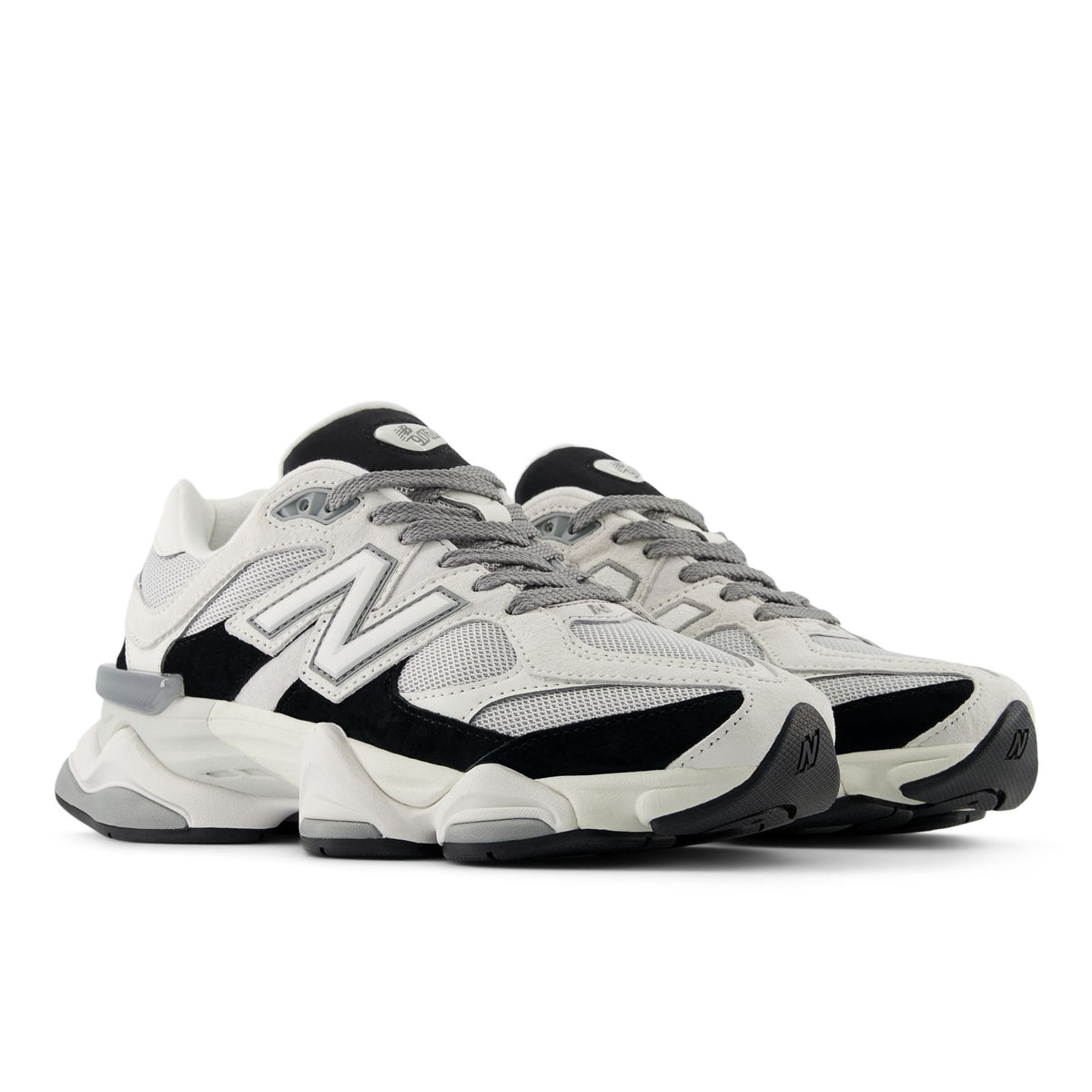 Unisex running shoes with gray mesh upper, black overlays, and white heel pull