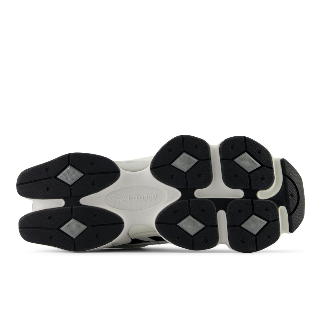 Unisex running shoes outsole view with black traction pods and light gray midsole