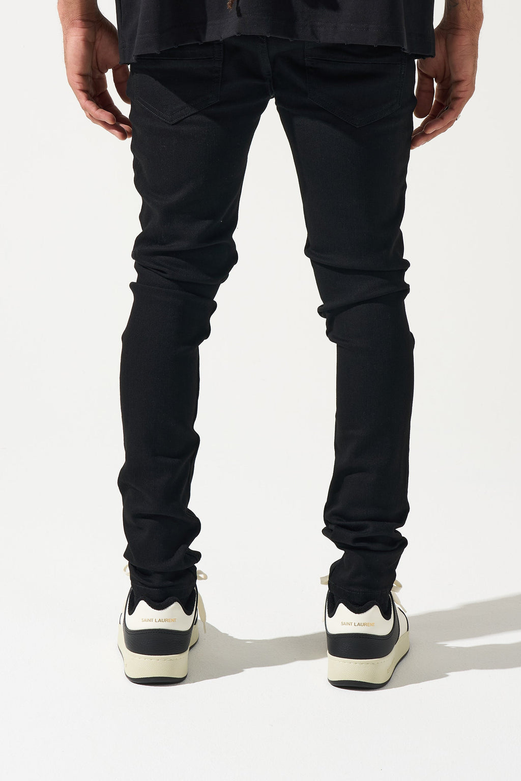 Men's black jeans with back yoke seam and slim tapered legs