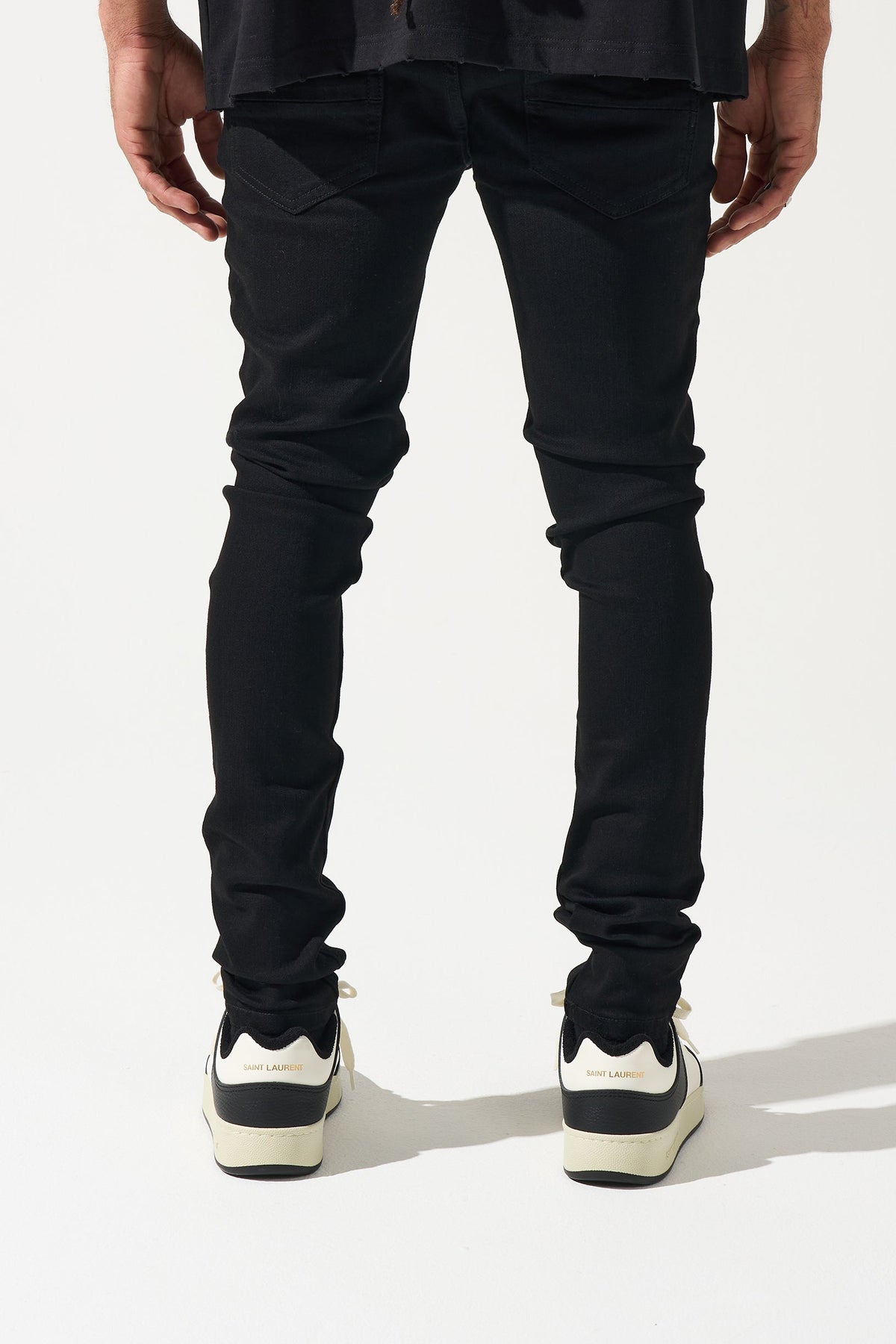 Men's black jeans with back yoke seam and slim tapered legs