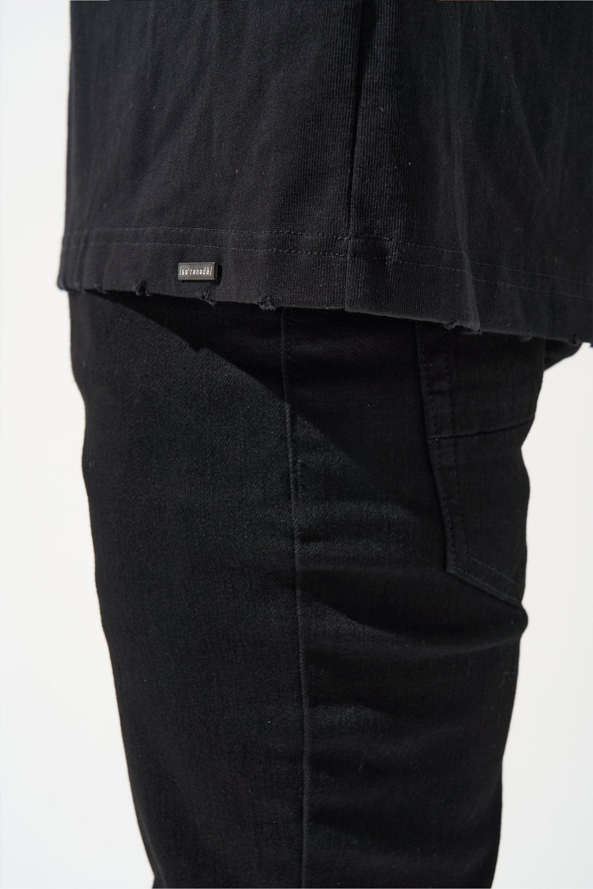 Men's dark jeans hem and pocket seam with folded over cuff detail